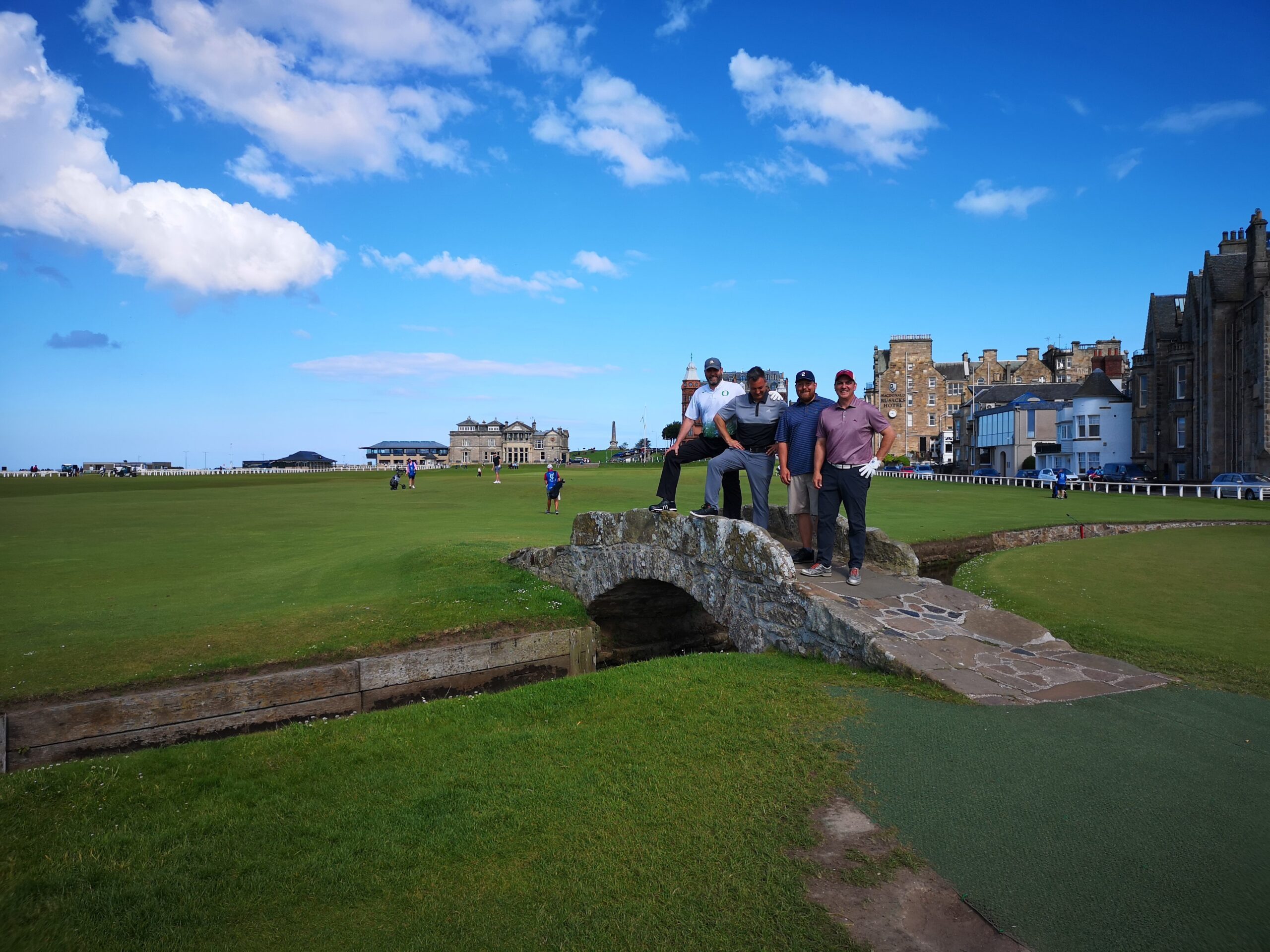 Golfers on the Swilcan Bridge on the 18th hole of the Old Course at St Andrews, Scotland