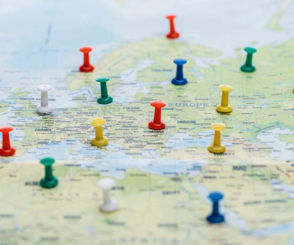 Map of Europe with pins marking destinations for international trip planning, ingenious travel